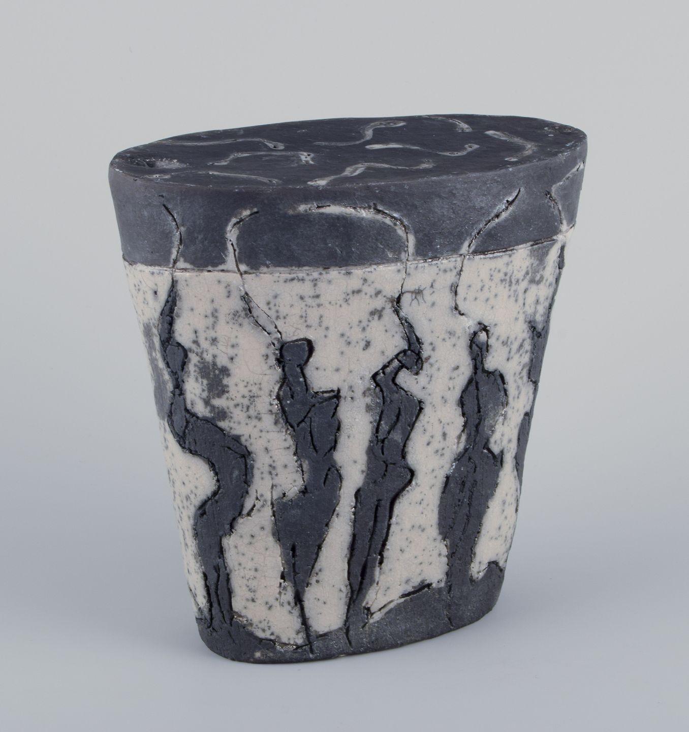 Pre-owned goods are exempt from import duties for U.S. customers. 
Therefore, no import tariffs will be applicable to your purchase.

European studio ceramicist.
Large unique ceramic sculpture with figurative frieze. Lava glaze.
Glaze in black and