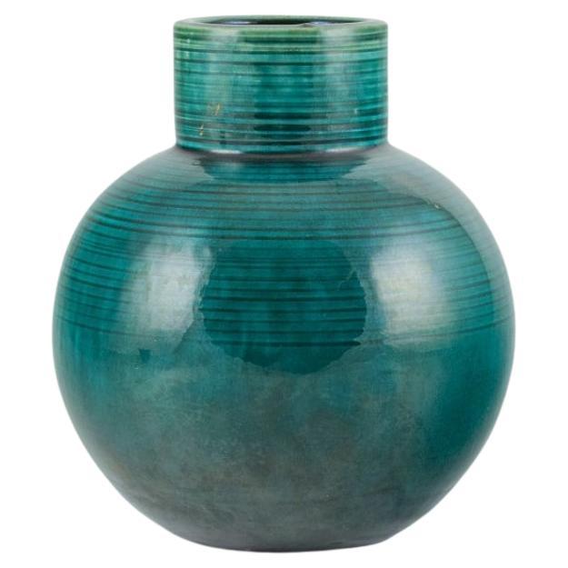 European studio ceramicist. Large ceramic vase with green glaze.