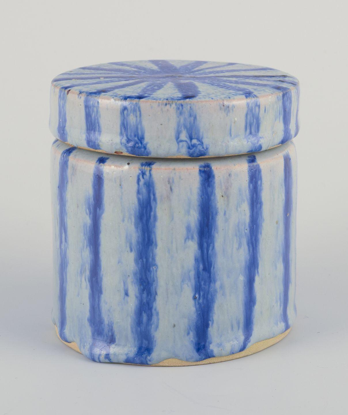 Unknown European studio ceramicist. Lidded jar made of earthenware. Striped design For Sale