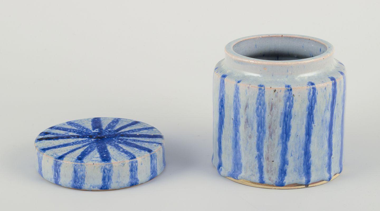 Late 20th Century European studio ceramicist. Lidded jar made of earthenware. Striped design For Sale