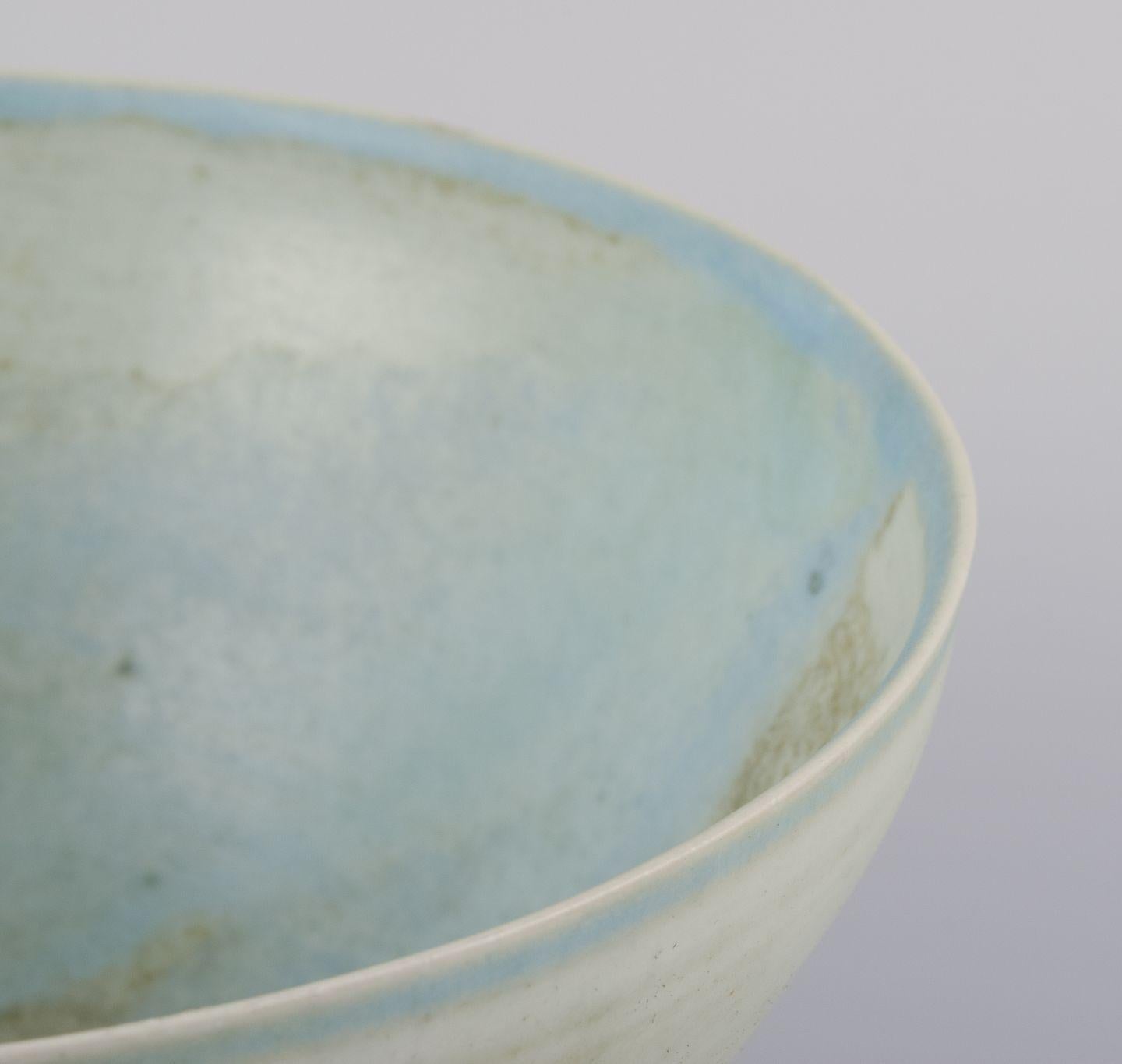 Unknown European studio ceramicist. Stoneware bowl. Hand-glazed in light tones. For Sale