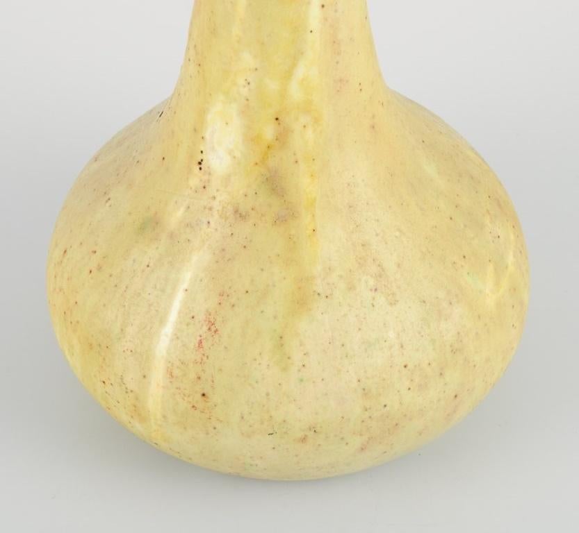 Glazed European studio ceramicist. Tall narrow-necked ceramic vase. 1960s For Sale