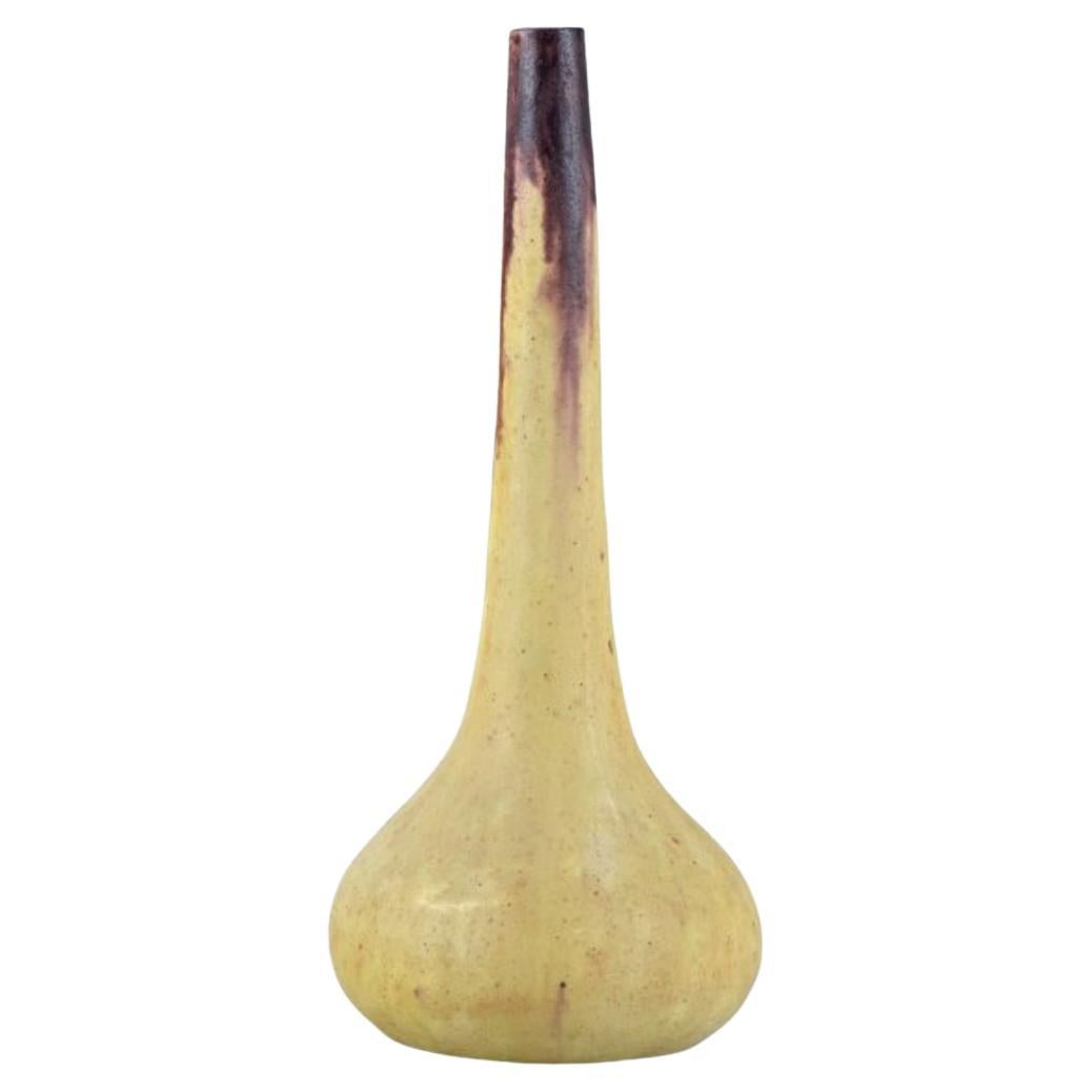 European studio ceramicist. Tall narrow-necked ceramic vase. 1960s For Sale
