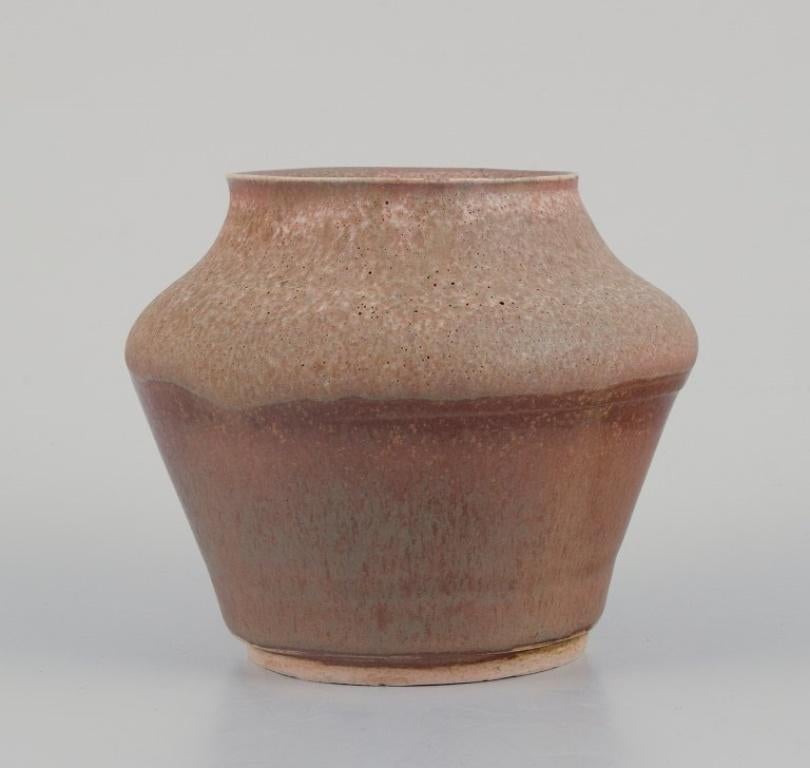 Unknown European studio ceramicist. Two unique ceramic vases. Glaze in sandy tones.  For Sale