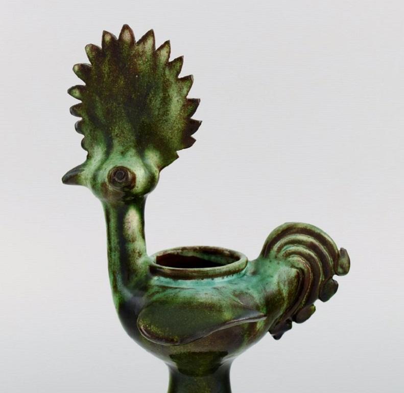 European studio ceramicist. Unique bird /vase in glazed stoneware. Beautiful glaze in shades of green. 
Late 20th century.
Measures: 25.5 x 13 cm.
In excellent condition.
Signed.