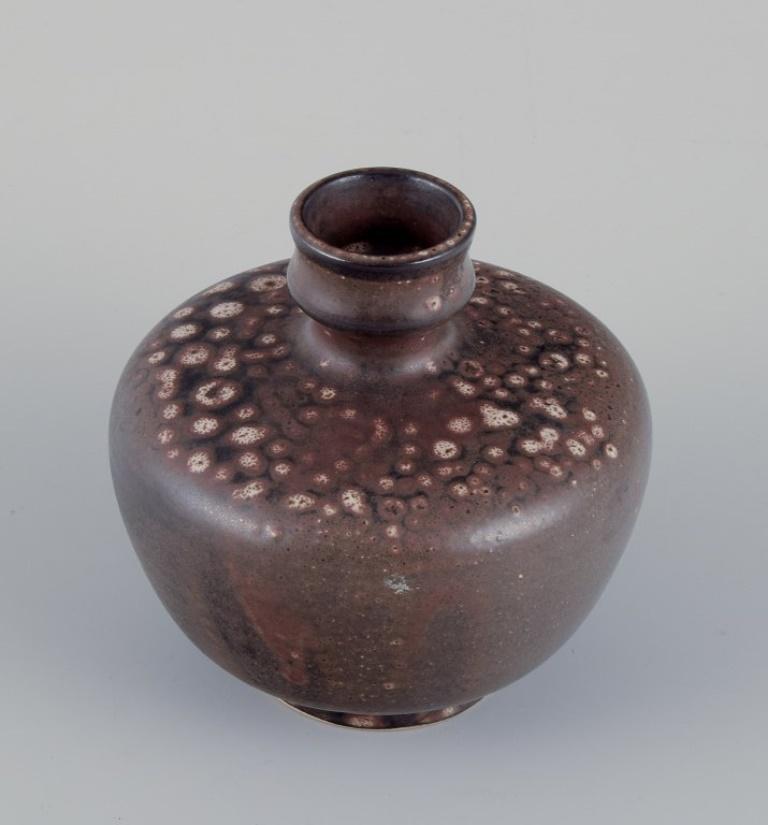 German European studio ceramicist. Unique ceramic vase. Glaze in brown tones. Ca. 1980s For Sale