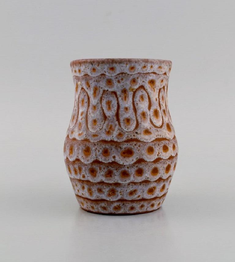 European studio ceramicist. Unique jug in glazed stoneware. 
Beautiful glaze in bright earth tones. 1960s / 70s.
Measures: 17.5 x 12 cm.
In excellent condition.
Signed.