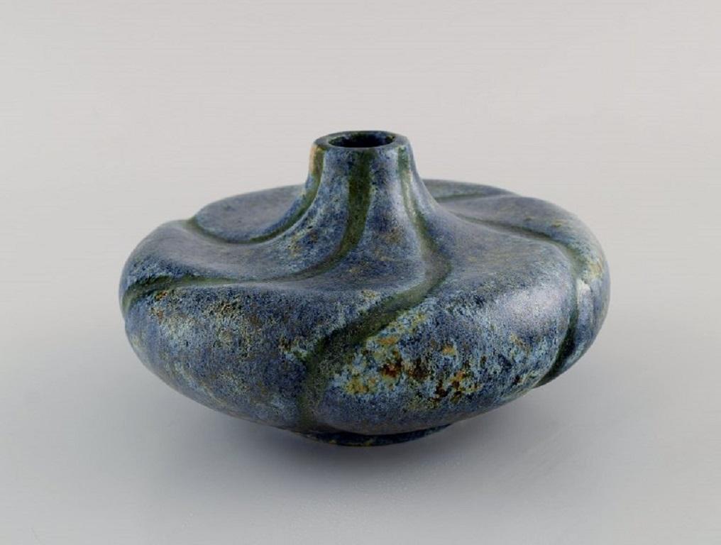 European studio ceramicist. Unique vase in glazed stoneware. 
Beautiful glaze in blue and light earth tones. 
1970s.
Measures: 16 x 9.5 cm.
In excellent condition.
Stamped.