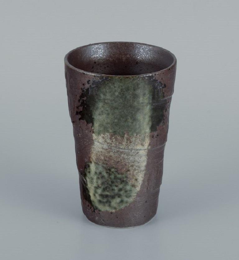 European studio ceramicist. Unique vase in green and white glaze on a brown background.
Approx. 1980s.
Marked.
In perfect condition.
Dimensions: Diameter 8.0 x height 13.0 cm.