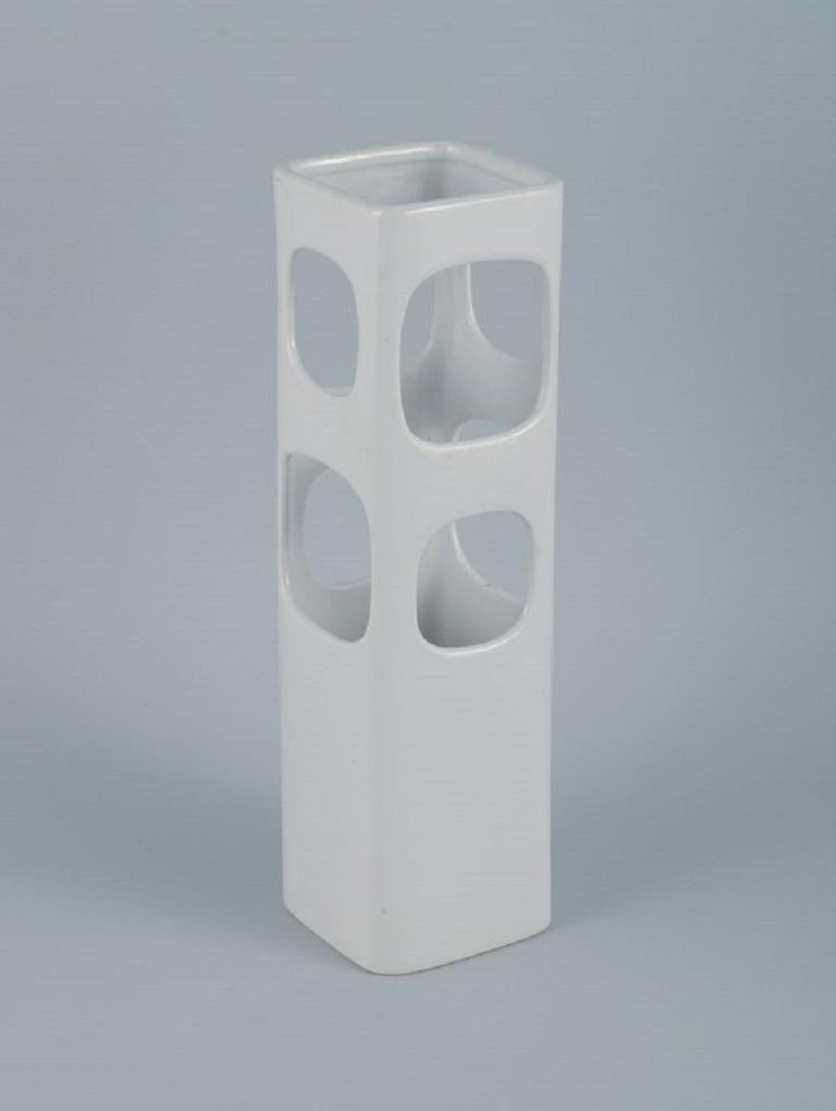 European studio ceramicist. Unique vase with eight holes in white glaze.
Late 1900s.
In great condition.
Measuring: Height 30.0 cm. x Diameter 8.5 cm.