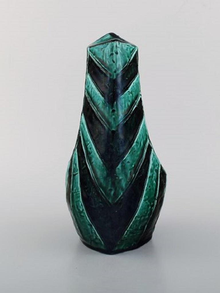 European studio ceramicist. Unique vase in glazed ceramics. Beautiful glaze in shades of blue and green. 
Striped design, 1960s / 70s.
Measures: 23.5 x 14.5 cm.
In excellent condition.
Signed.