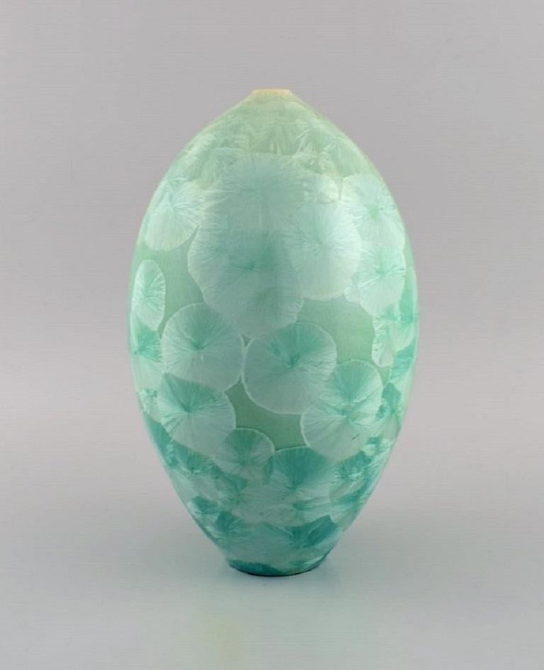 European studio ceramicist. Vase in glazed stoneware. Beautiful crystal glaze in turquoise shades. 
Late 20th century.
Measures: 25.5 x 16 cm.
In excellent condition.
Signed.