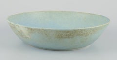 European studio ceramicist. Very large bowl with glaze in light blue tones.