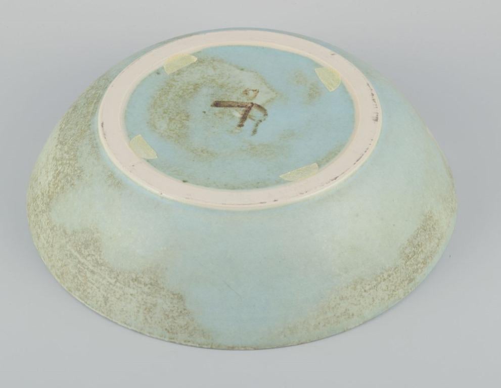 Ceramic European studio ceramicist. Very large bowl with glaze in light blue tones. For Sale