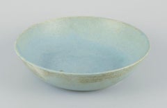European studio ceramicist. Very large bowl with glaze in light blue tones.