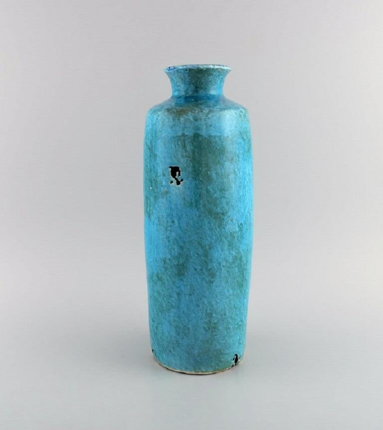 European studio ceramist. Large unique vase in glazed stoneware. 
Beautiful glaze in turquoise shades. 1970/80s.
Measures: 35 x 13 cm.
In excellent condition.