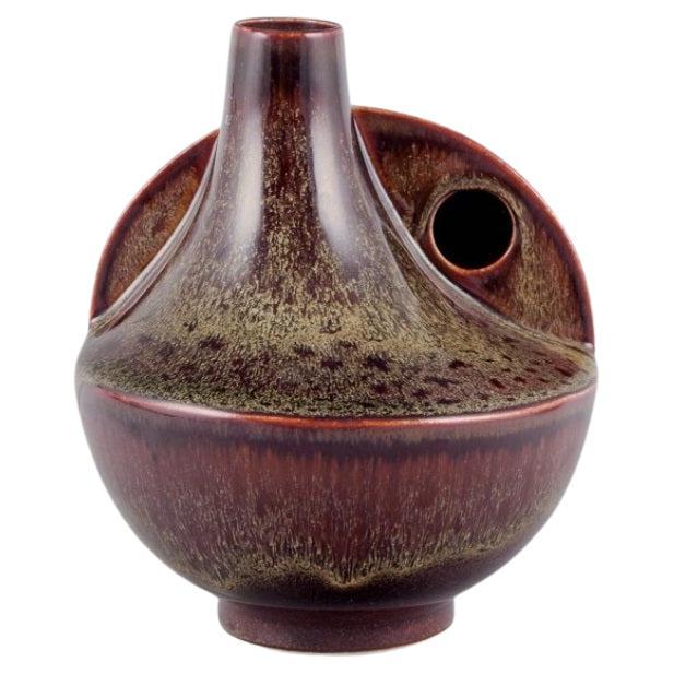 European studio ceramist. Unique ceramic vase with speckled glaze in brown tones