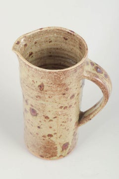 European studio potter. Stoneware pitcher with rustic glaze, 1980s