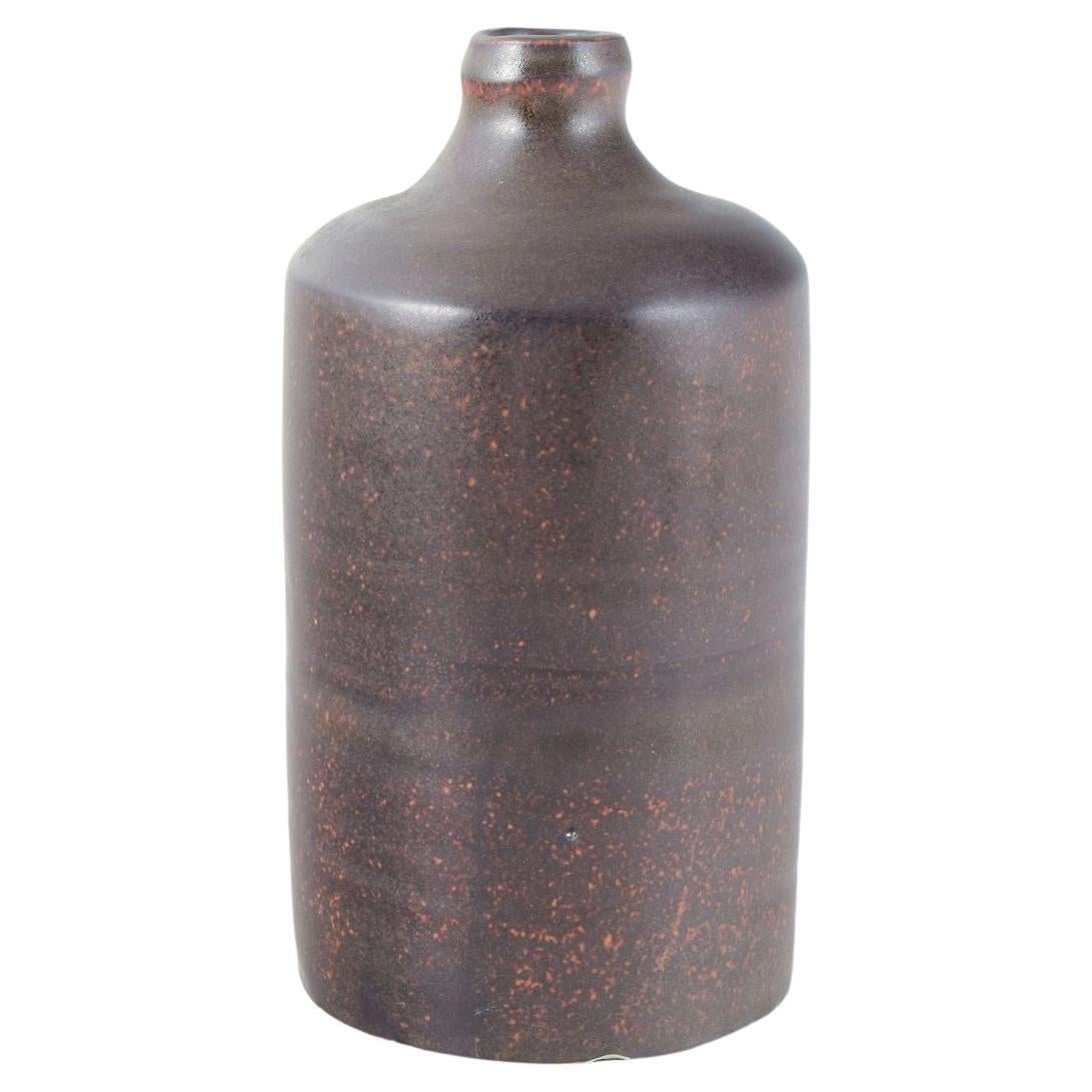 European studio potter. Tall cylindrical vase with deep violet glaze.