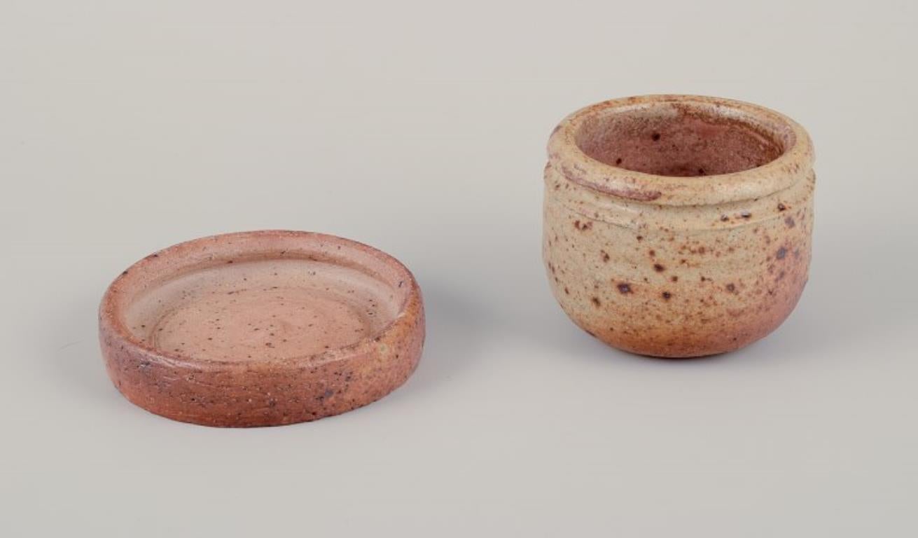 Unknown European studio potter. Two unique ceramic jars, one with a lid. For Sale