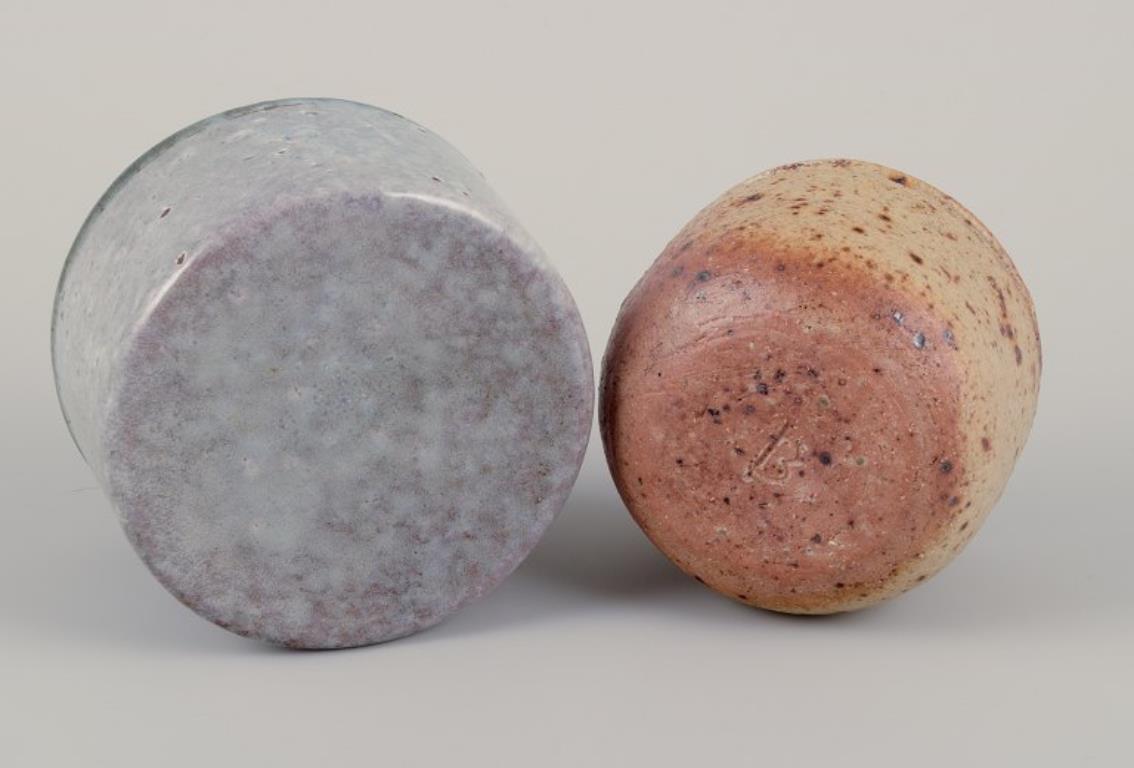 Ceramic European studio potter. Two unique ceramic jars, one with a lid. For Sale