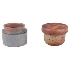 European studio potter. Two unique ceramic jars, one with a lid.