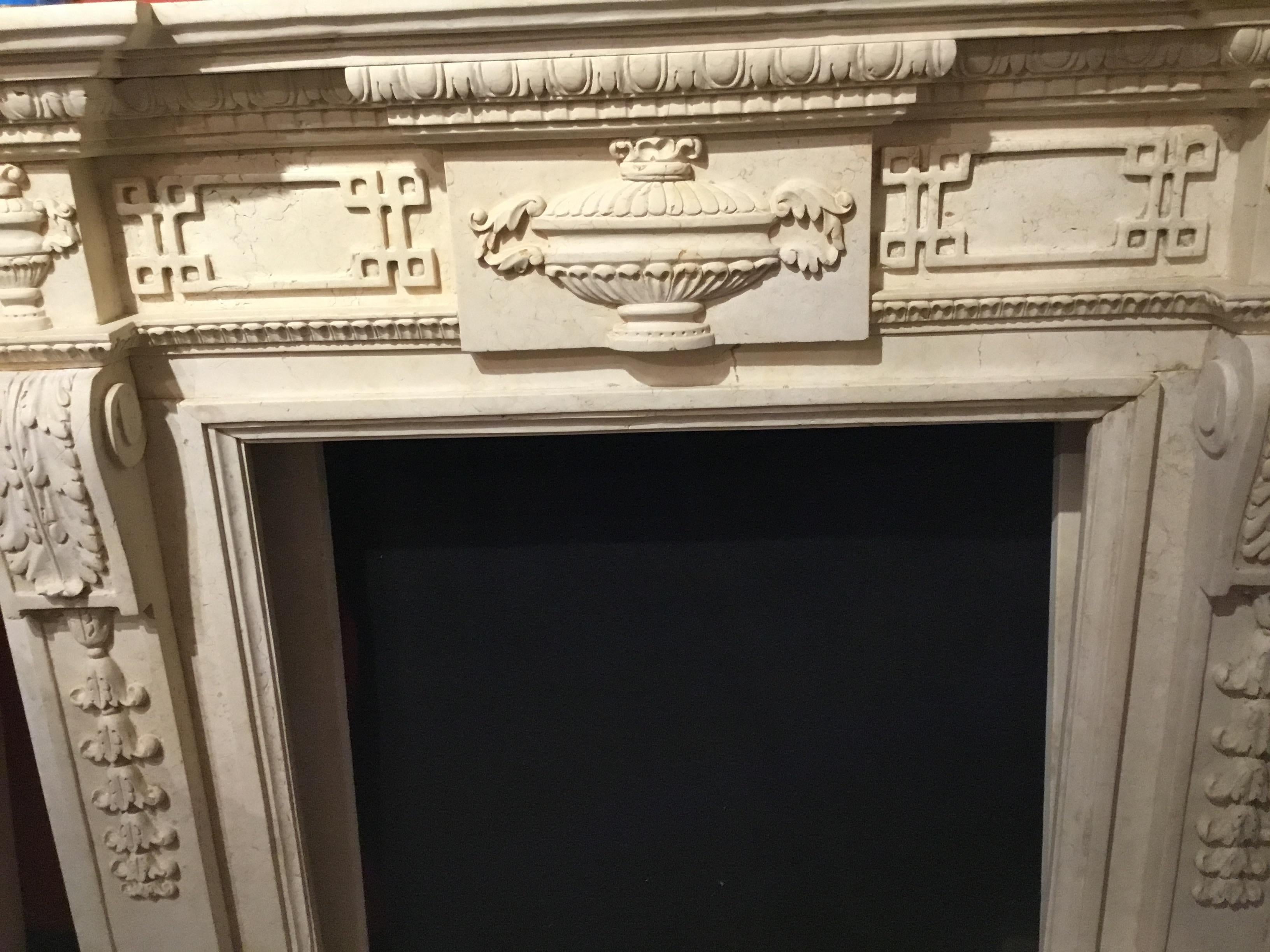 Beautifully carved cream marble hand carved with a central urn in the middle of this piece.
The side supports are gracefully curved in a corbel shape.
Inside measurements are 31” wide
Height 31.5” high
This mantel is in my gallery for viewing and it