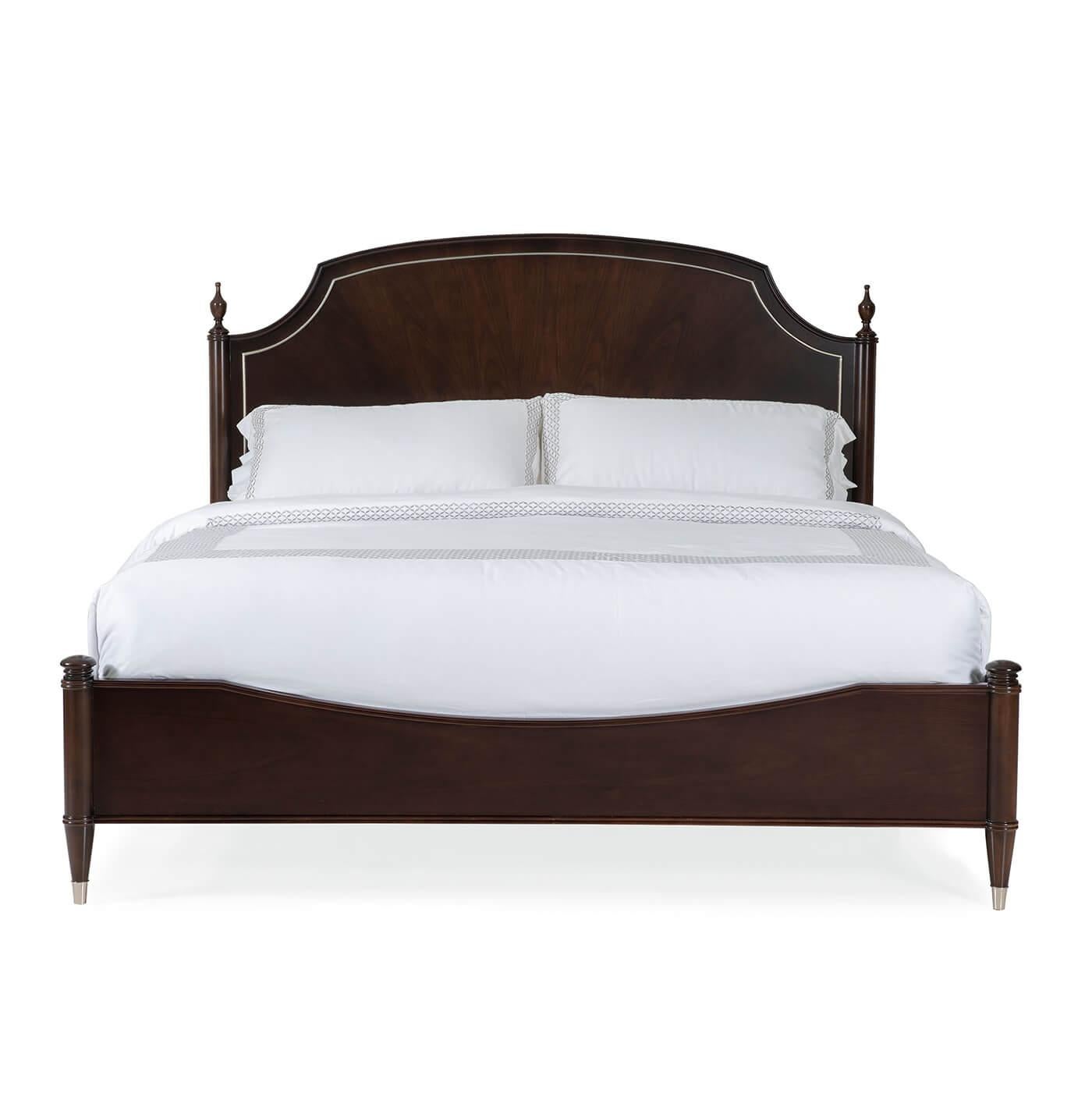 A European-style king bed with a heritage-style headboard. This bed has a modern classic design, inspired by an 18th-century Neo Classic antique, and has a beautiful Mocha Walnut finish. Cathedral walnut veneers create a magnificent radial pattern