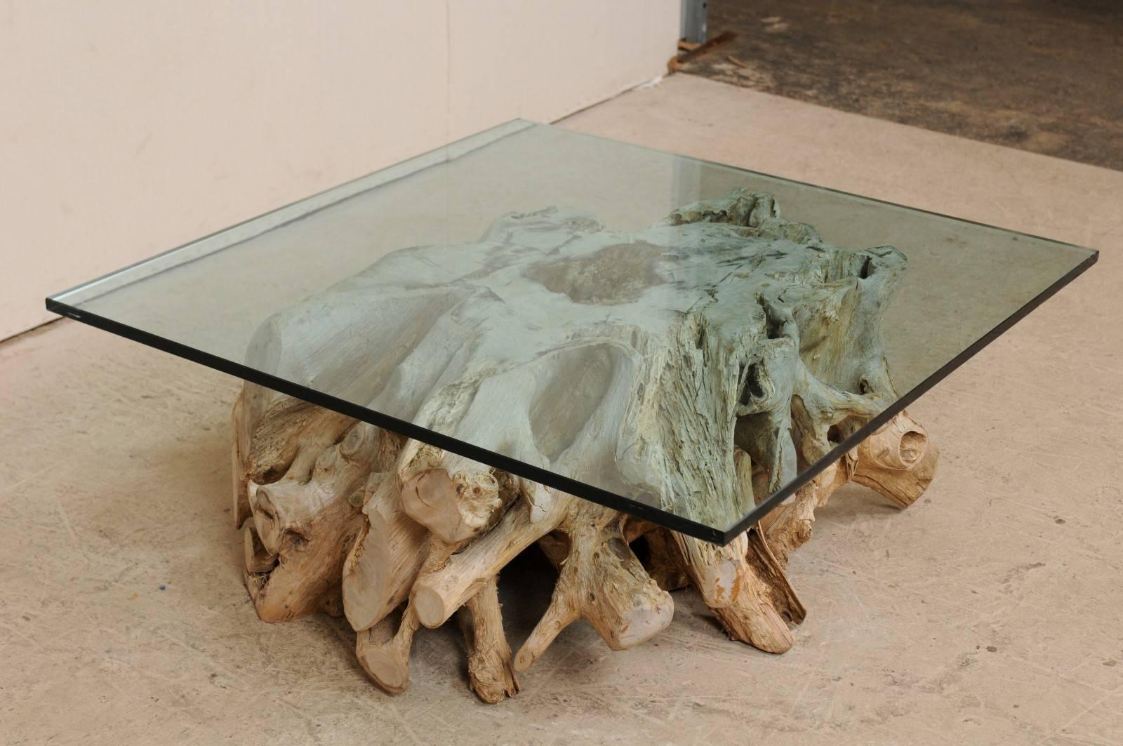 glass coffee table with tree trunk base