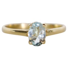 14k Yellow Gold Solitaire Ring with Oval Brilliant-Cut Aquamarine