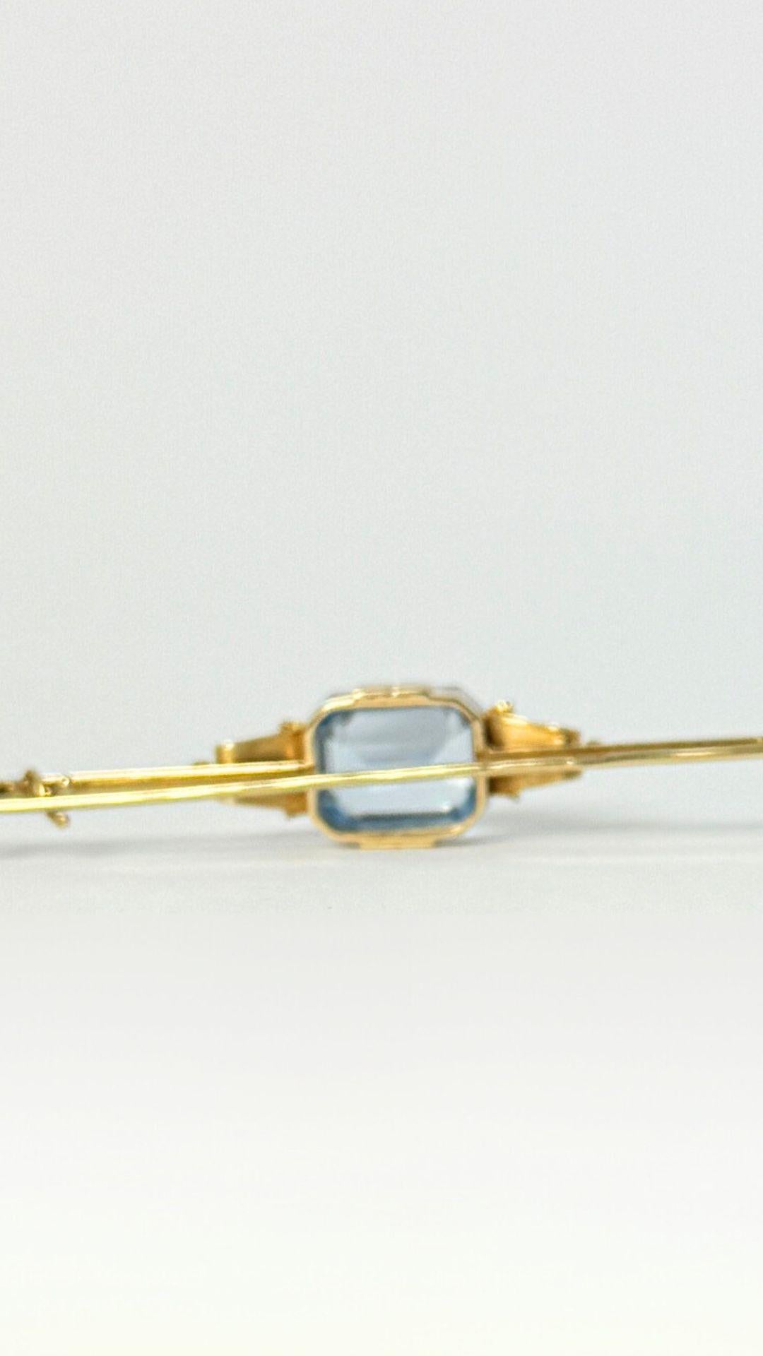 Women's European vintage pin 14 carat gold with blue topaz For Sale