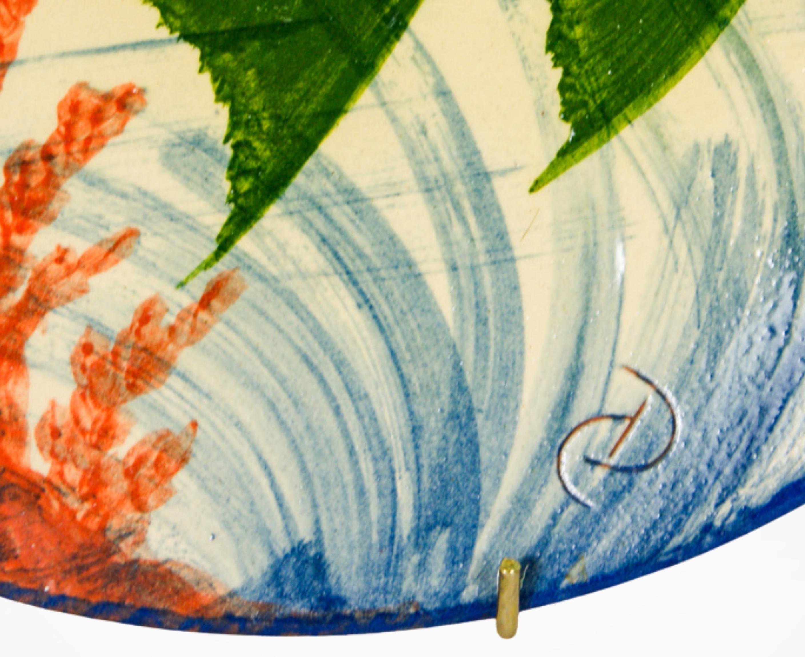 Large sized ceramic wall hanging plate by Catalan ceramist Eusebi Diaz Costa circa 1960s.
Exquisitely hand painted and depicting a fish mid swim amongst coral reef.
The plate is signed by the artist.

Eusebi Díaz Costa (1908–1964) was a visionary