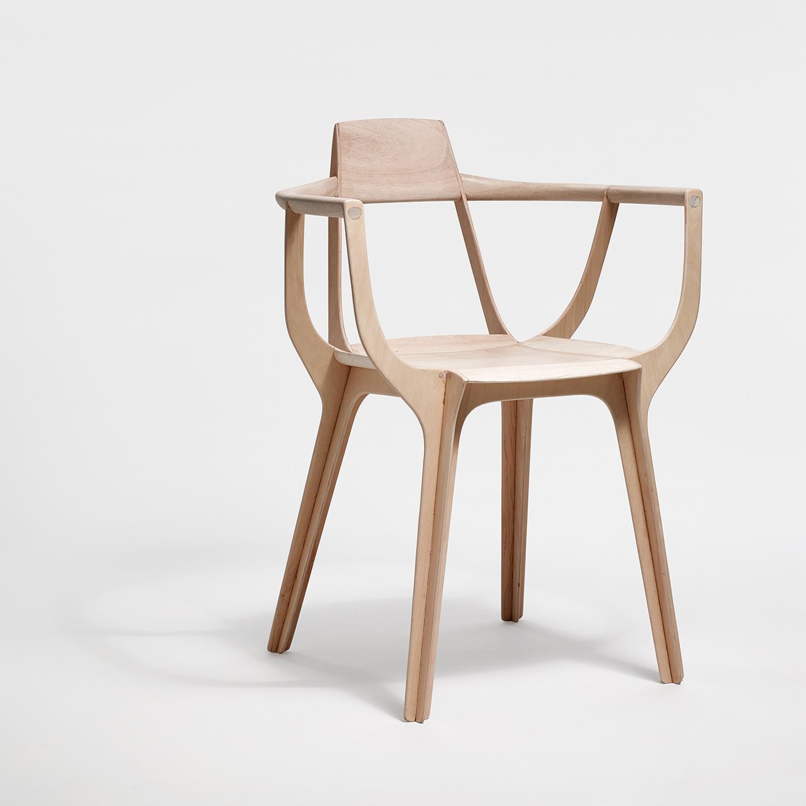 Eutopia has a sophisticated structure: this armchair is made up of four pieces of multi-laid wood that intersect and then separate again in the seat, allowing different planes to work in their own forceful directions to hold the seat and the