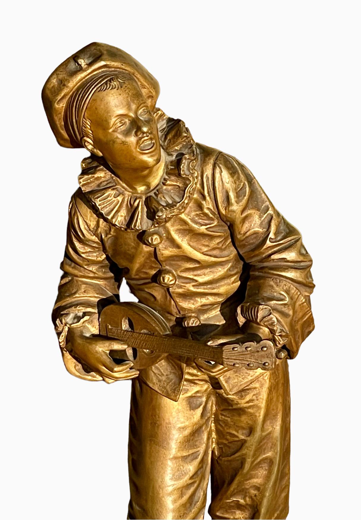 Pierrot in bronze playing the mandolin, signed 
