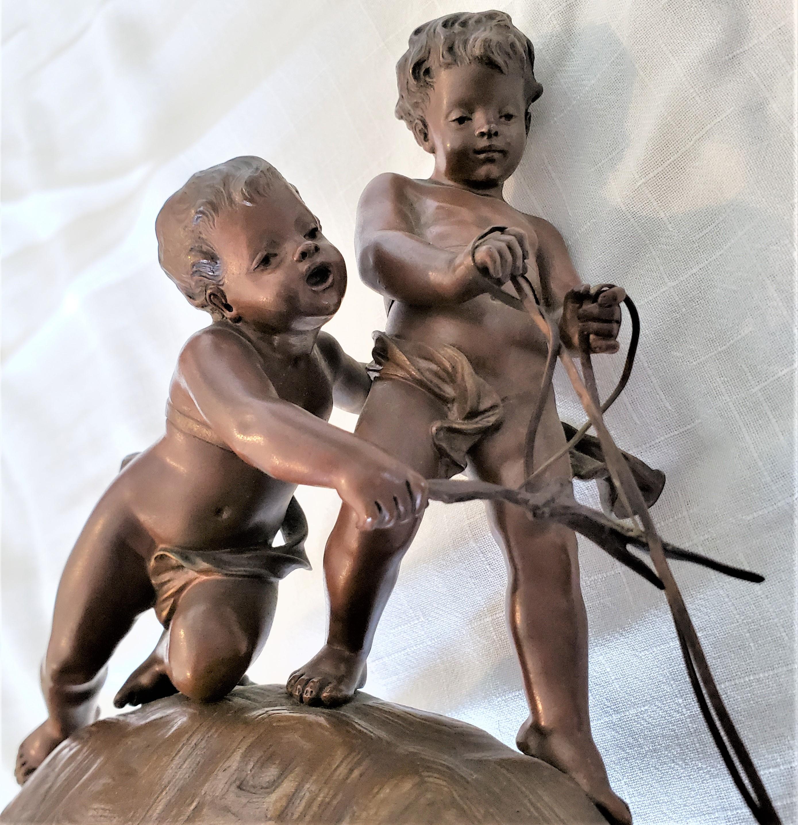 Bronze Sculpture française ancienne en bronze signée Eutrope Bouret représentant des garçons chevauchant une tortue en vente