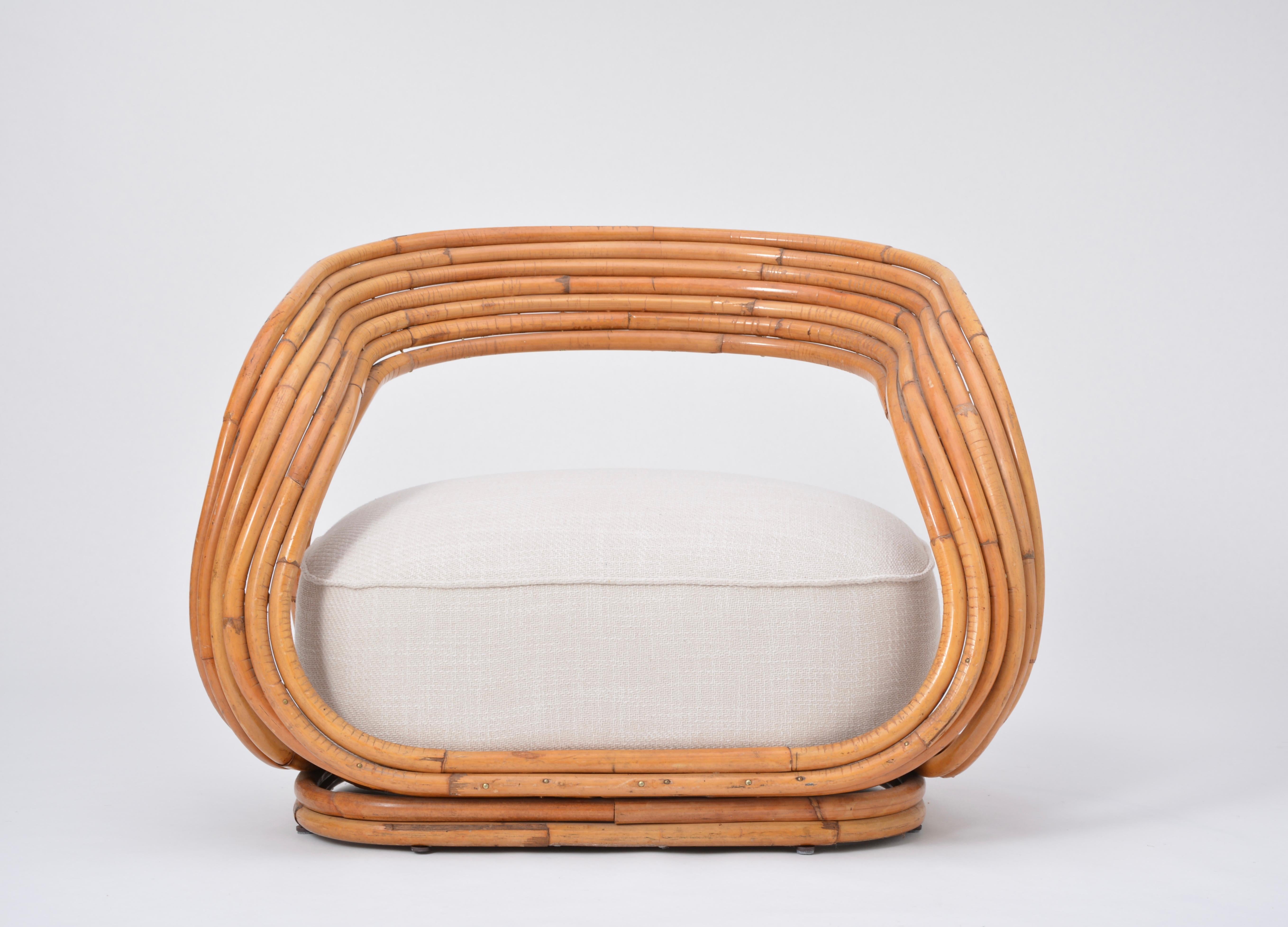 Eva armchair designed by Giovanni Travasa in 1965. Produced by Vittorio Bonacina in Italy.
Rattan structure. Its structure is accomplished by bringing together the rattan and curving it by the use of fire. The ample cushion filling provides a