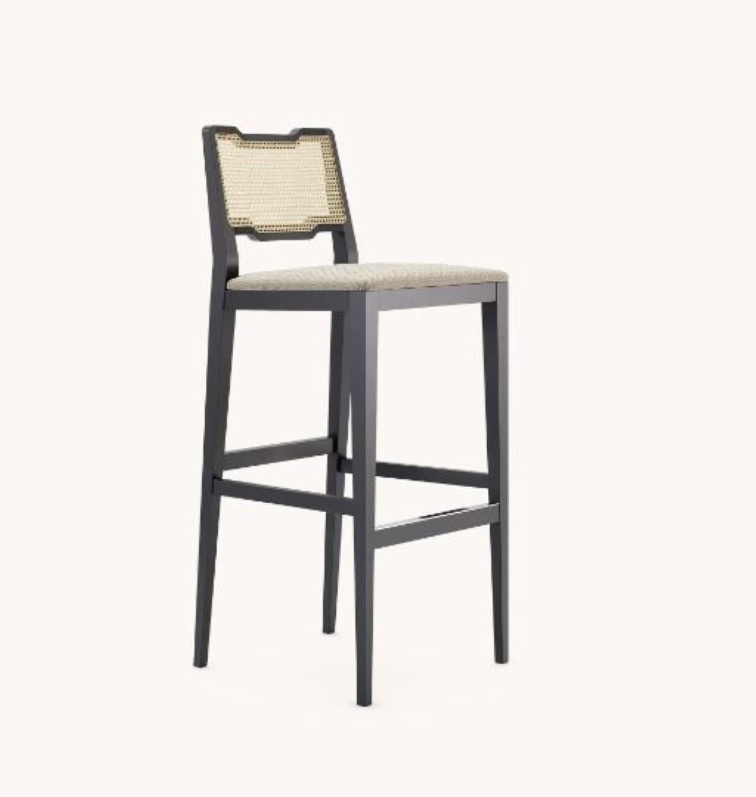 Eva bar chair by Domkapa
Materials: patterned, black lacquered, wood. 
Dimensions: W 46 x D 47 x H 110 cm. 
Also available in different materials. 

Made to last, the solid wood structure of Eva bar and counter chairs are the perfect mixes of a