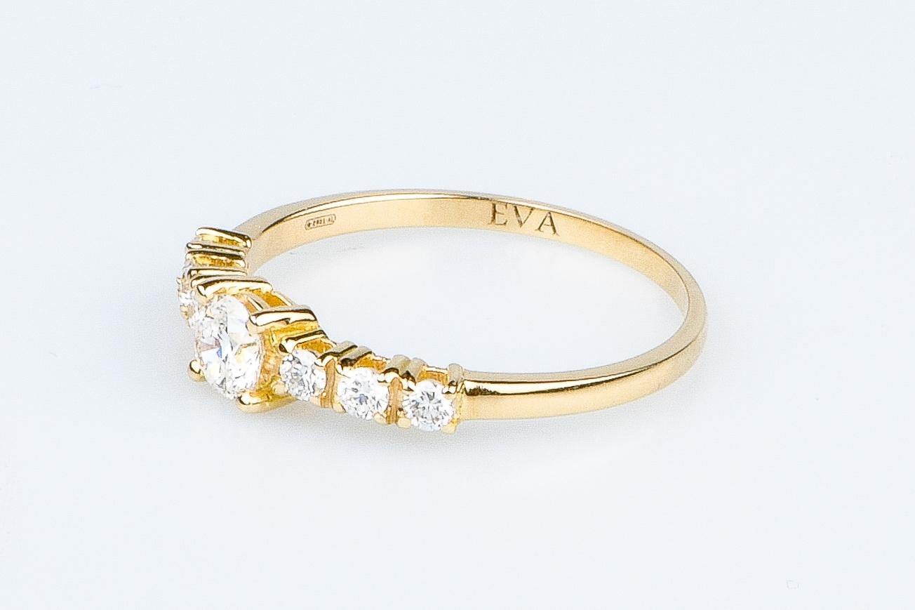 LUNA model, solid 18K yellow gold ring adorned with 7 round brilliant synthetic diamonds of 0.68 carats (1 diamond of 0.50 carat and 6 diamonds of 0.03 carat each).

• Carats: 0.68 ct

• Color: DEF

• Clarity: VS

• 2.40 grams

• Available sizes