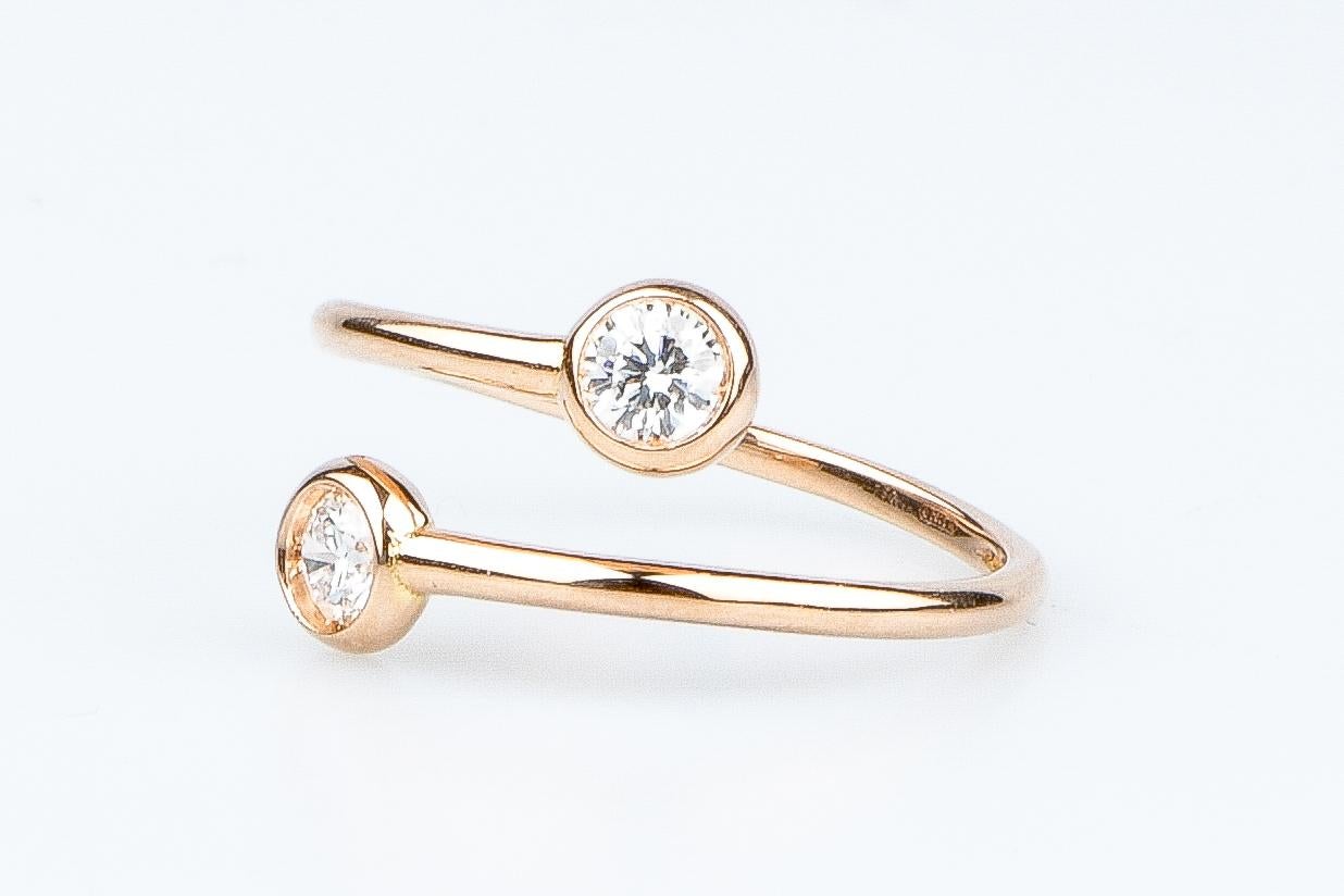 MILENA model, solid 18K pink gold ring adorned with 2 round brilliant synthetic diamonds of 0.40 carats (0.20 carat each.)

• Carats: 0.40 ct

• Color: DEF

• Clarity: VS

• 1.95 grams

• Available sizes (EU): 48 to 58, free size adjustment.

•
