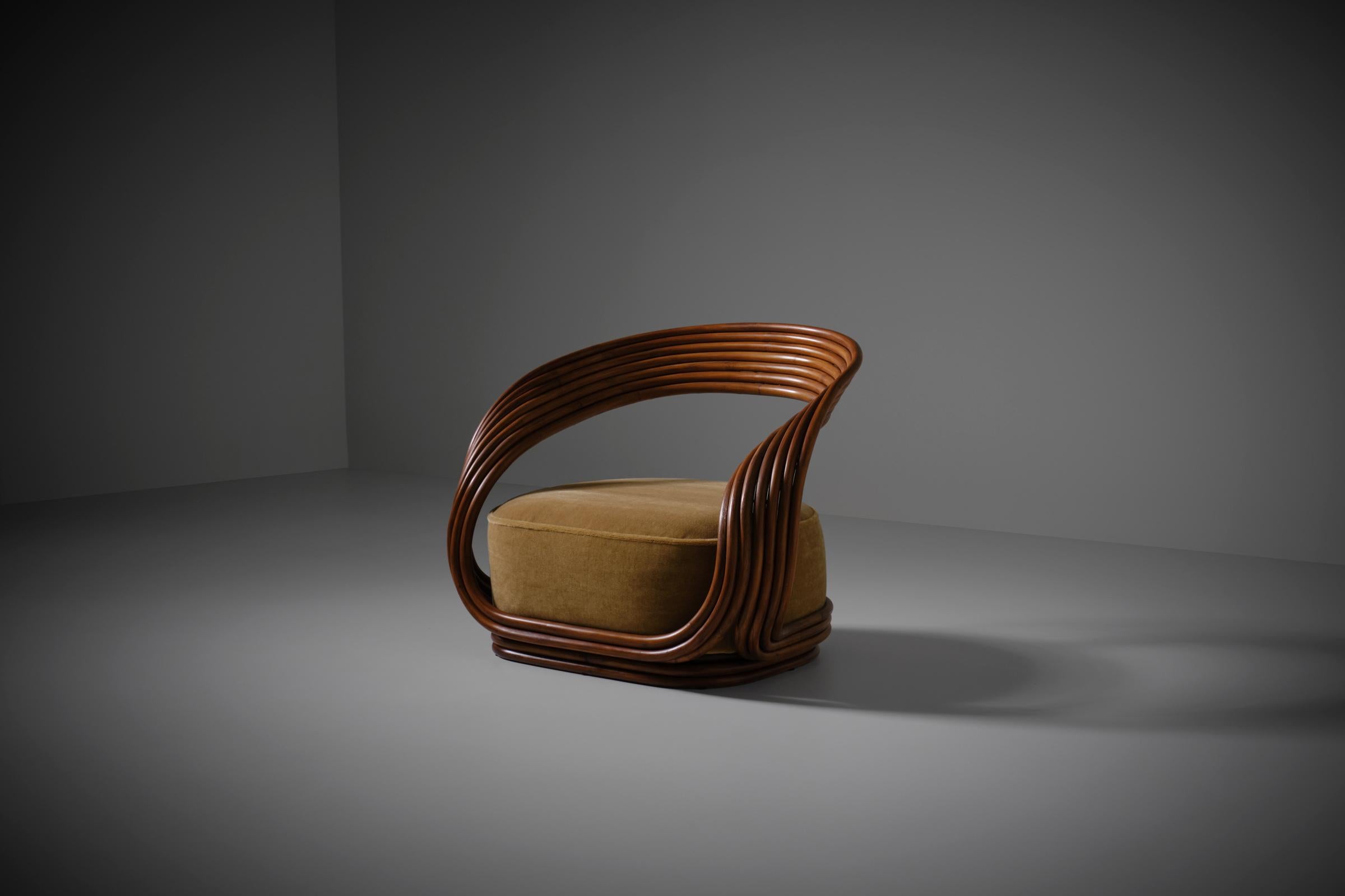 Original Eva armchair by Giovanni Travasa for Vittorio Bonacina, Italy, 1965. Beautiful sculptural bent bamboo frame which are shaped together like ribbons with a large cushioned seat. The old model is different from the newer production, the old