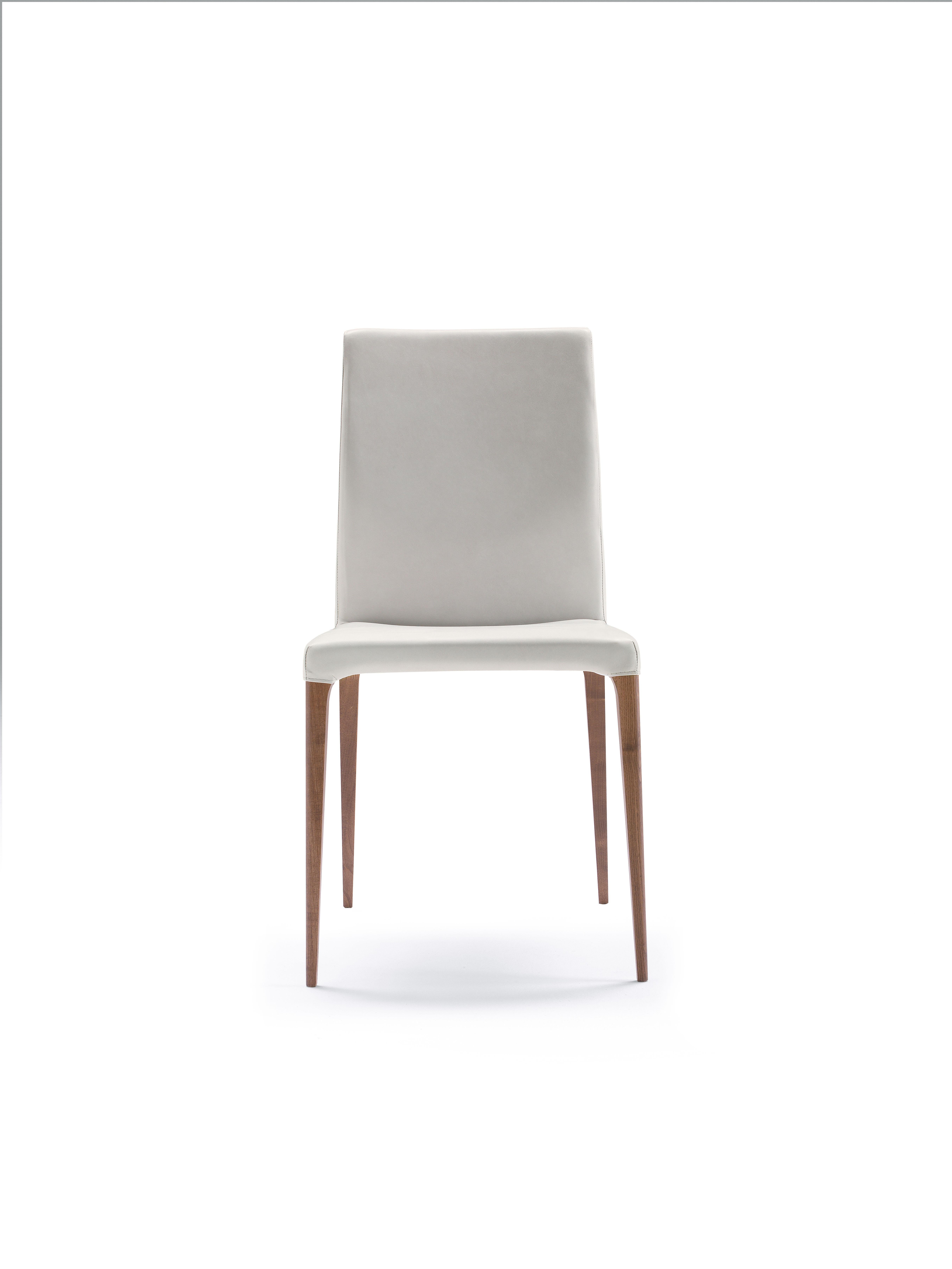 Chair with structure in solid ash. Seat and backrest covered in leather, eco-leather or fabric of our collection. Fixed or removable fabric. Available finishings: FN natural ash, CL American cherry, WG wengé, NC walnut, TB tobacco, open pore matte
