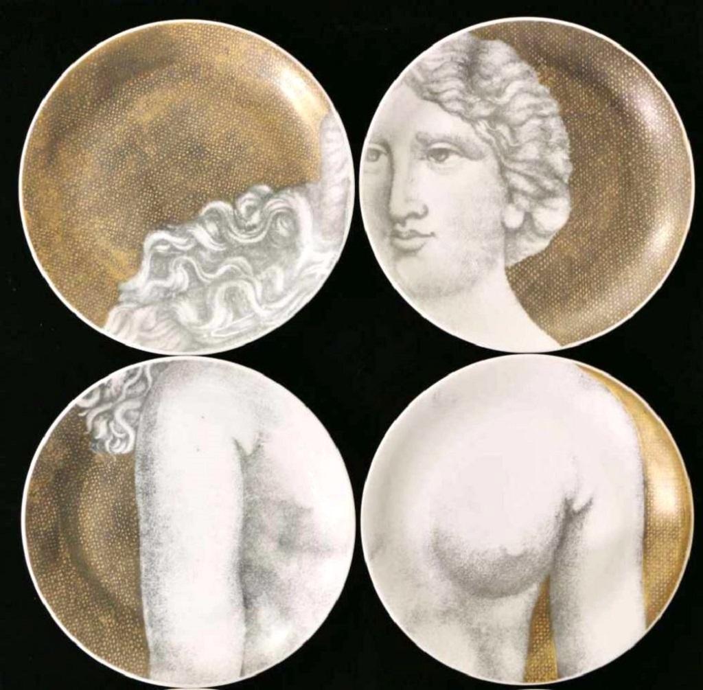 Fornassetti's plates - Eva is a superb decorative object designed by Piero Fornassetti and manufactured by the Italian company Fornassetti circa 1970s.

Twelve wall plates made of Fine porcelain and gold ground with black printed decor.

On the