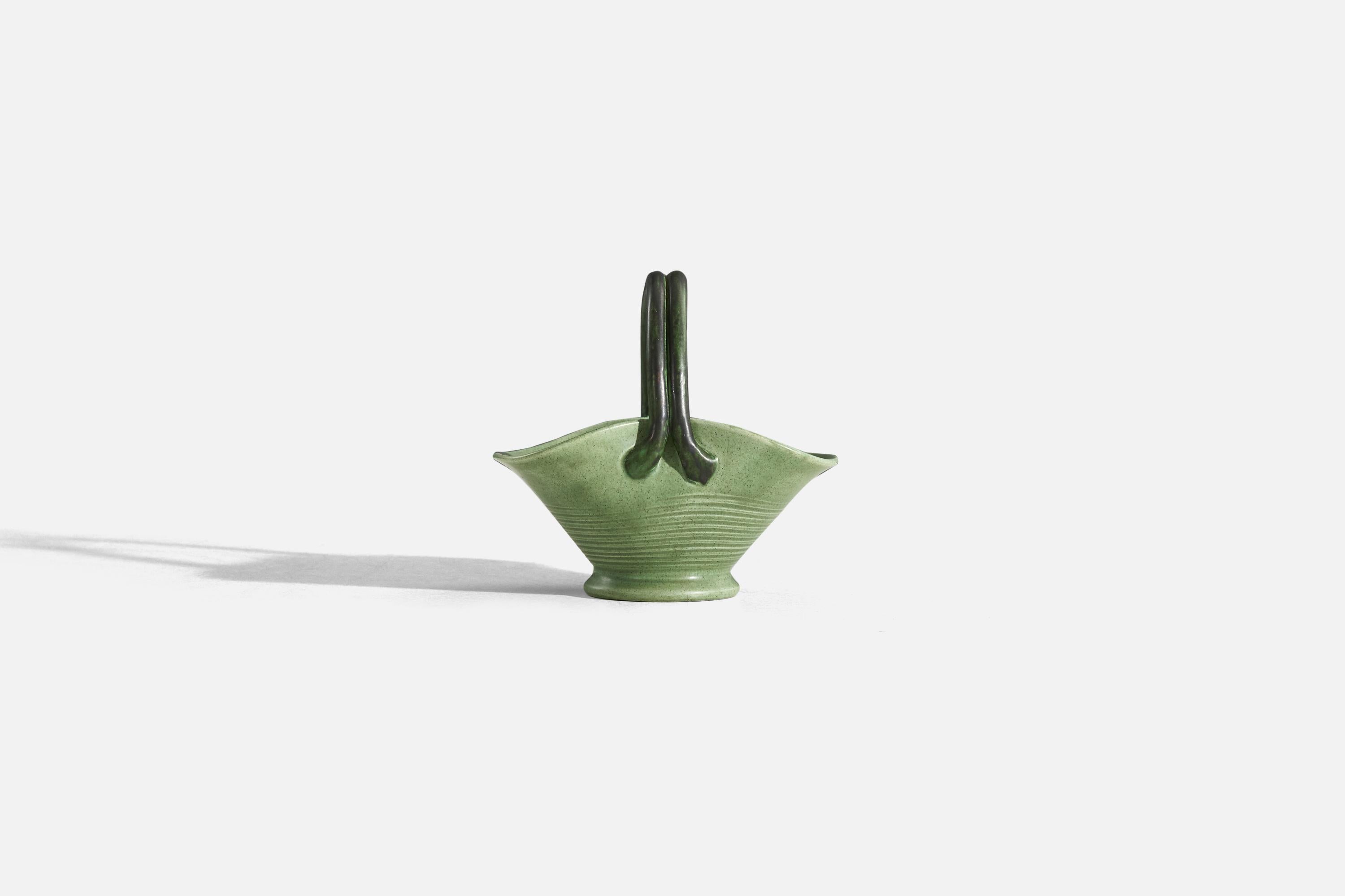 A green-glazed earthenware bowl designed by Eva Jancke Björk and produced by Bo Fajans, Sweden, 1940s. 