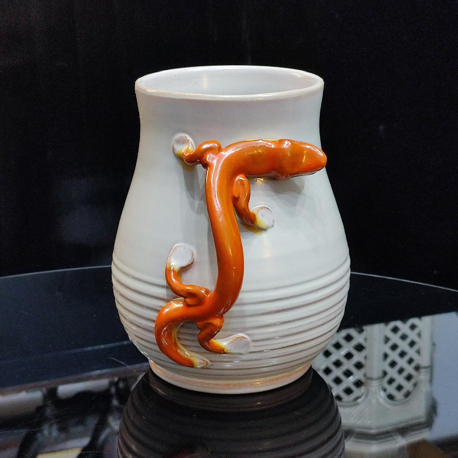 Rare find, Unique Salamander Faience Vase, designed by Eva Jancke-Björk, BO Fajans Gefle, Sweden, 1920s
The faience vase was decorated with an orange-red lizard against the beige background, which can be used as a handle. 
Height 18 cm.
It is in