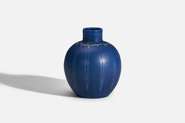 A blue glazed earthenware vase designed by Eva Jancke Björk and produced by Bo Fajans, Sweden, 1940s.