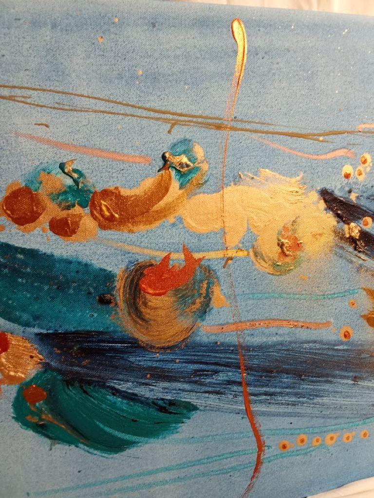 This artwork is a striking abstract composition defined by its vibrant blue background, which serves as a dynamic canvas for contrasting colors and textures. The piece is dominated by bold streaks of deep navy and azure, interspersed with splashes