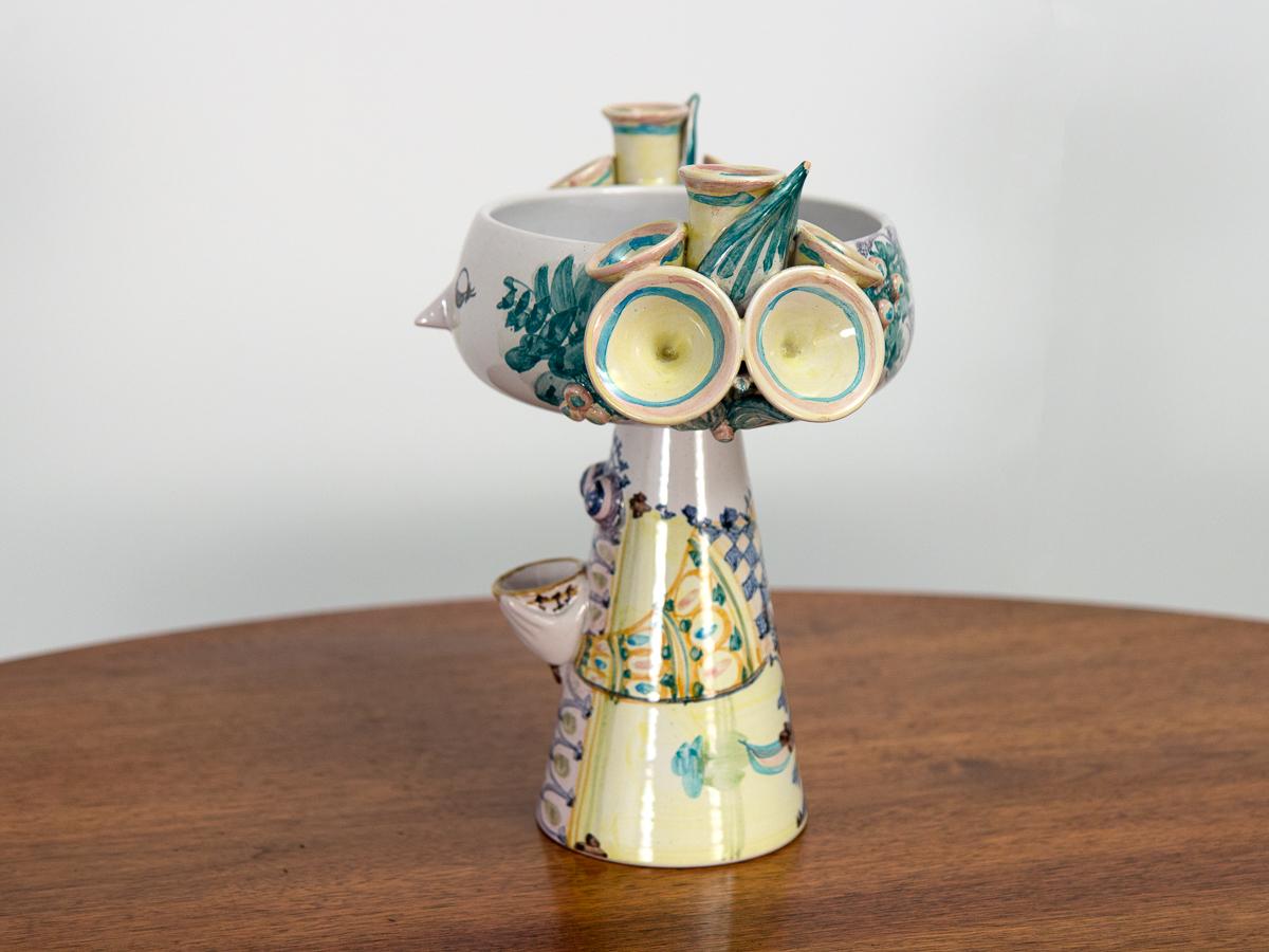 Figural pedestal bowl by the celebrated Danish ceramicist and illustrator Bjørn Wiinblad. Inspired by folk tales, the artist creates functional ceramic tablewares that are also whimsical sculptures. This fantastical sprite called Eva wears a