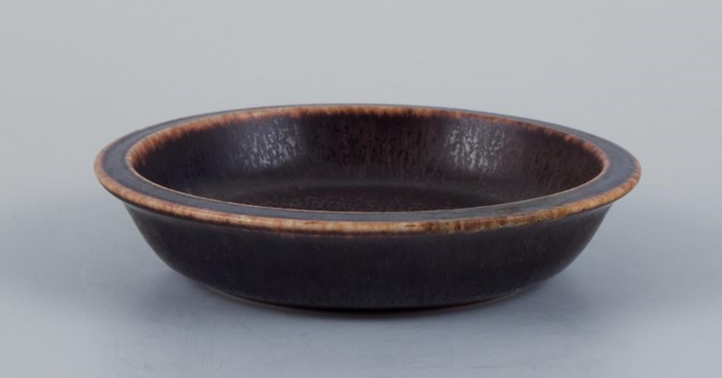 Eva Stæhr Nielsen for Saxbo, small ceramic bowl with glaze in brown tones.
Mid-20th century.
Marked.
Perfect condition.
Dimensions: D 10.5 x H 2.5 cm.