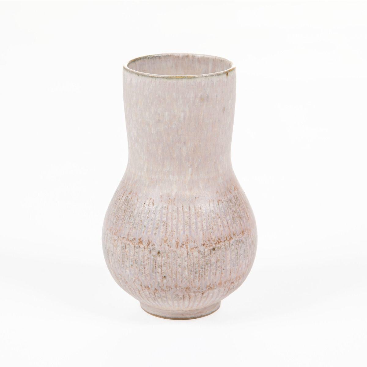 Unique small stoneware vase with a matte white-grey glaze, designed for Saxbo.
Signed with the monogram E.S.F.N. and Saxbo on the base.
Produced between 1932 and 1951, during the period when Eva Stæhr-Nielsen was Saxbo’s sole designer.

She is