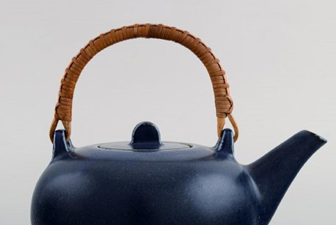 Danish Eva Stæhr-nielsen for Saxbo, Teapot in Glazed Ceramics with Handle in Wicker For Sale
